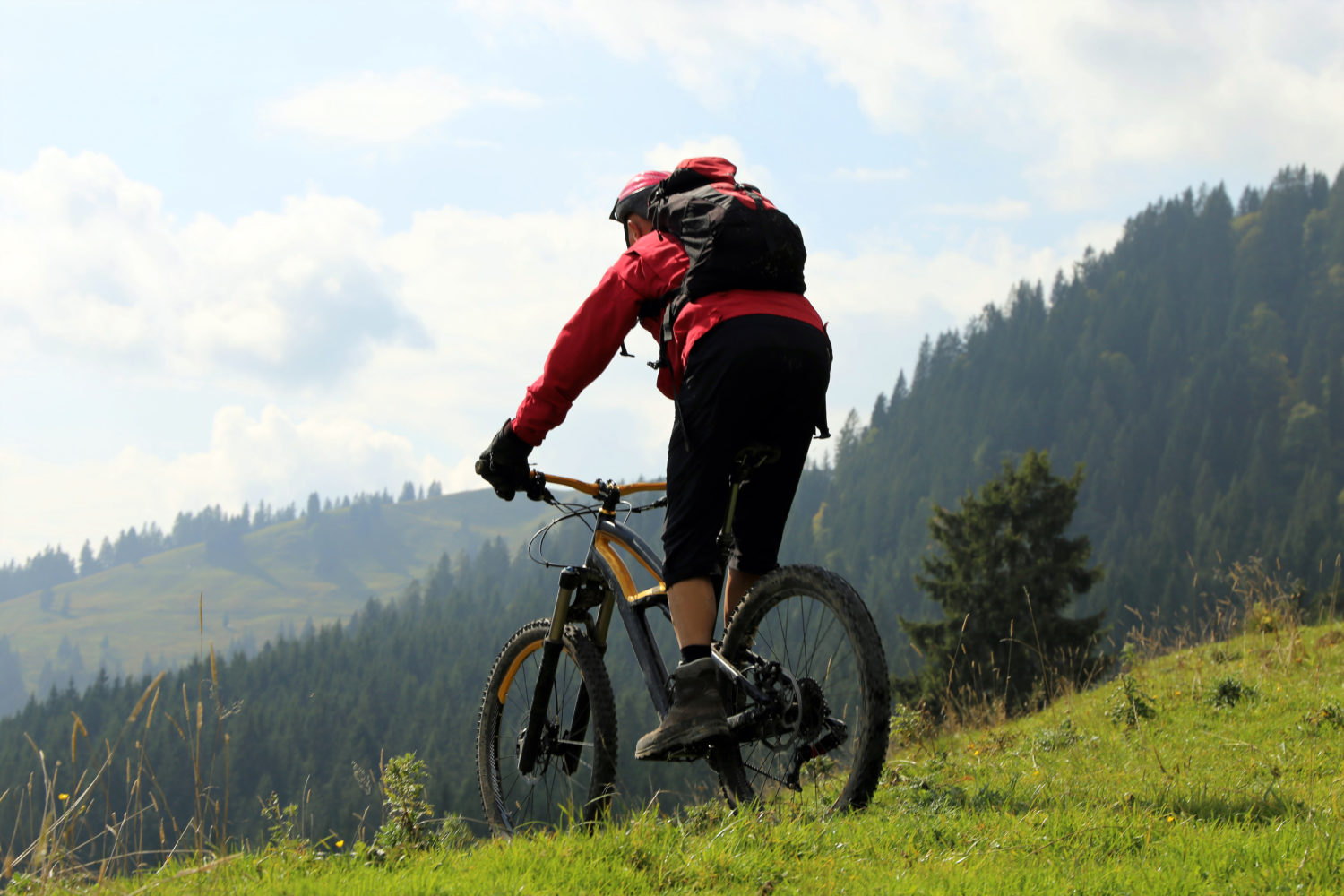 Man on a mountain bike in hilly countryside 